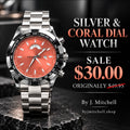 Silver-tone bracelet watch with coral dial and black bezel